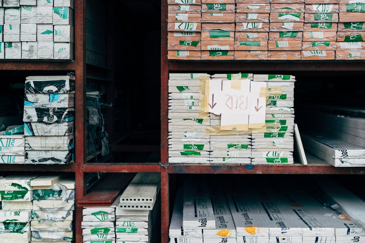 Image of a warehouse showcasing organized stacks of building materials on shelves.